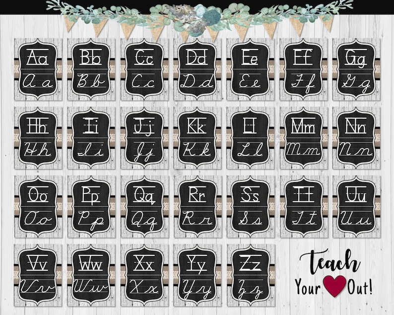 May include: A set of twenty-six rectangular cards featuring the alphabet in both uppercase and lowercase cursive script on a black chalkboard background with a white wood grain border and a decorative banner with the text Teach Your Heart Out.