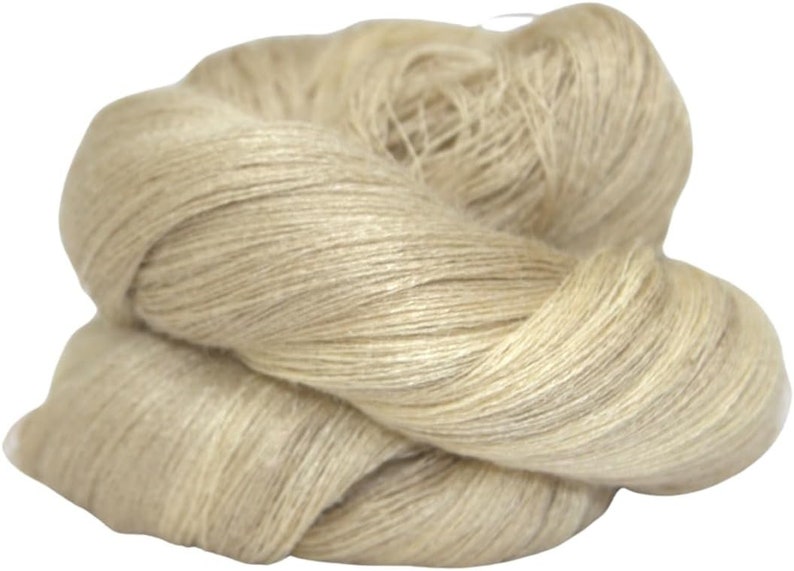 May include: A skein of natural beige linen yarn. The yarn is soft and fluffy, and it is perfect for knitting or crocheting.