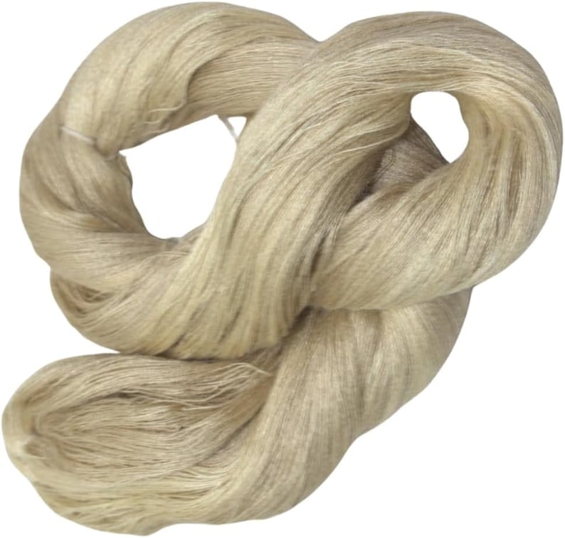 May include: A skein of natural beige linen yarn, perfect for knitting or crocheting.