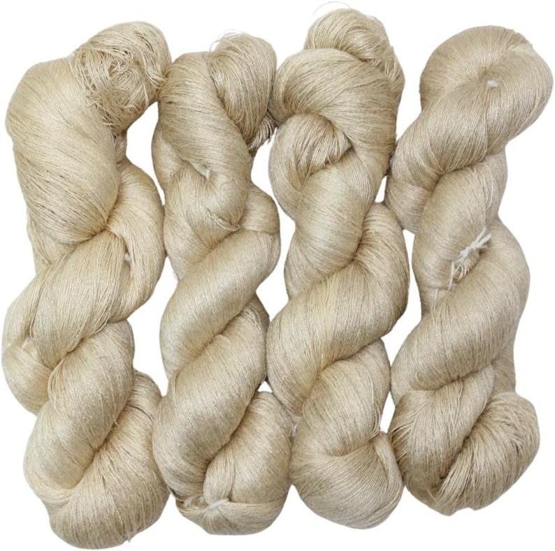 May include: Three skeins of beige yarn, each skein is twisted and tied into a knot.
