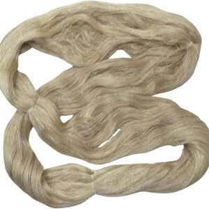 May include: A bundle of natural beige linen yarn, perfect for knitting or crocheting.