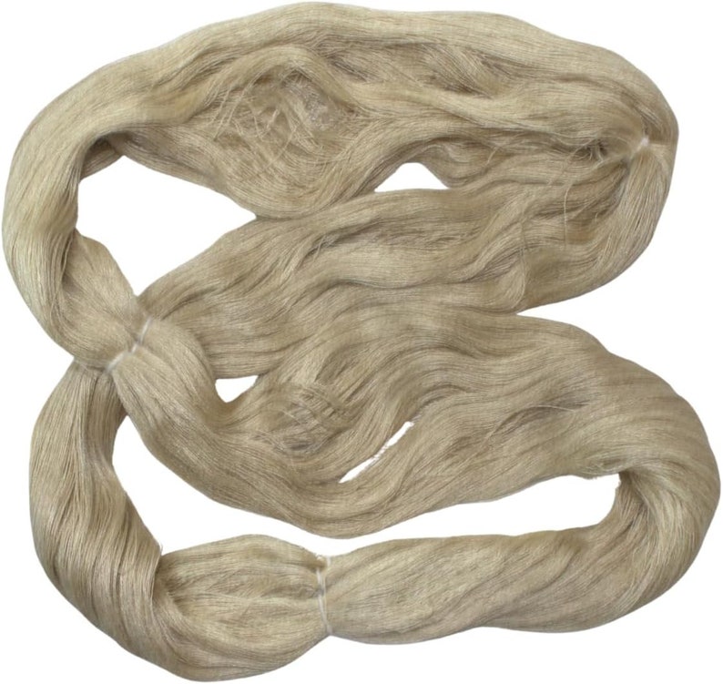 May include: A bundle of natural beige linen yarn, perfect for knitting or crocheting.