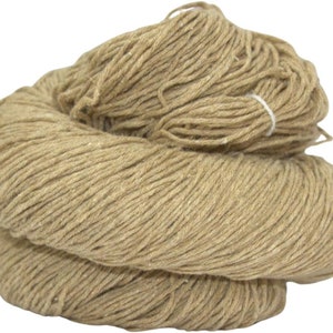 May include: A large ball of natural brown twine or string. The twine is tightly wound and ready for use in crafts, gardening, or other projects.