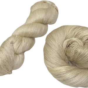 May include: Two skeins of natural colored linen yarn. One skein is twisted into a rope shape, the other is loosely coiled.