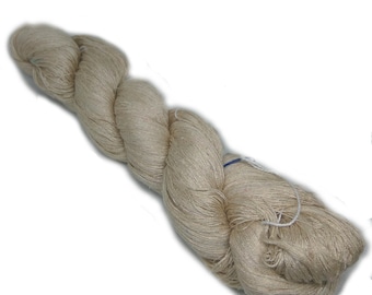 May include: A skein of beige yarn, likely made of silk or linen, is twisted and coiled together. The yarn is soft and delicate, and it would be perfect for knitting or crocheting.
