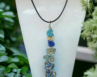 Blue swirl spiral pendant, lightweight statement jewellery, dramatic and bold necklace, handcrafted twisted wire necklace, made in Cornwall,