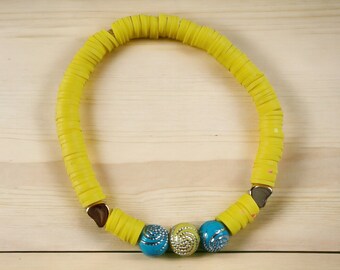 Bright yellow beaded elasticated bracelet suitable for all ages, clay beaded, fun and lightweight, made in Cornwall, sparkly swirl beads