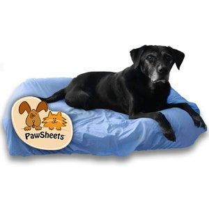 May include: A black dog resting on a light blue pet bed. The bed is made of a soft, crinkled material. A logo with a cartoon dog and cat is in the lower left corner. The logo reads "PawSheets".