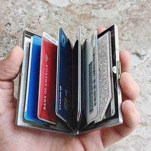 Open Stainless Steel Credit Card Holder to show card slots and cards inside