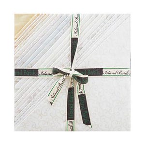 May include: A bundle of 12 white fabric squares with a subtle pattern, tied together with a brown ribbon with the text "Island Batik" printed in green.