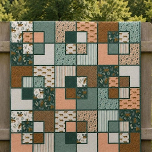 May include: A patchwork quilt featuring a repeating block pattern in shades of dark green, peach, tan, and white. The fabric squares display various prints including small tigers, tropical leaves, vertical stripes, and textured solid colors.