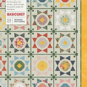May include: A quilt pattern called "Shine On" by BasicGrey featuring a patchwork design with a variety of colors and patterns. The pattern is called "PATO43" and is a sewing pattern.