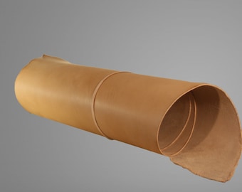 May include: A rolled up piece of light brown leather.