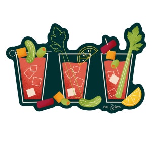 May include: Three glasses of red tomato juice with various garnishes, including celery stalks, olives, pickles, and lemon wedges. The glasses are on a dark green background with the text "PIXEL & STITCH" in white.