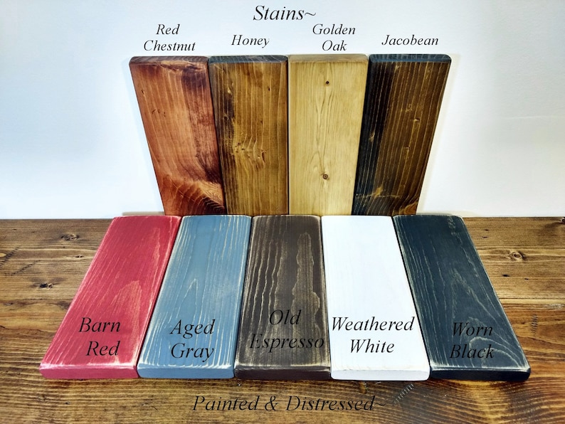 May include: Wood stain colour chart displaying 10 different stain colours. The top row shows Red Chestnut, Honey, Golden Oak, and Jacobean. The bottom row shows Barn Red, Aged Grey, Old Espresso, Weathered White, and Worn Black. The text "Stains~" and "Painted & Distressed" are also visible.