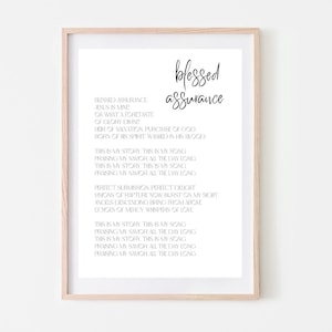 May include: A printable wall art design featuring the text "Blessed Assurance" and a hymn about Jesus Christ. The text is in black font on a white background.