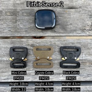 May include: Three different colored Cobra buckle styles: black, coyote brown, and mini black. Each buckle is labeled with the brand name "COBRA" and the model number "FM25". The mini black buckle is labeled "FM20". The buckles are shown next to a Fitbit Sense 2 smartwatch.
