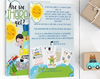 May include: A book titled "Are We There Yet?" with a yellow car and a smiling sun on the cover. The back cover features a description of the book, which includes games, puzzles, activities, and travel tips. The book is designed for ages 7-12.