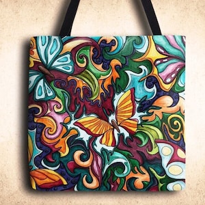 May include: A colorful tote bag with a whimsical design featuring butterflies and swirls in shades of blue, green, yellow, orange, pink, and purple.
