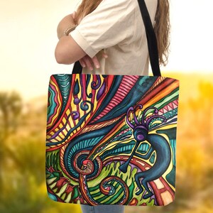 May include: A colorful tote bag with a psychedelic design featuring swirling lines, abstract shapes, and a blue figure with a red, yellow, and green headdress.