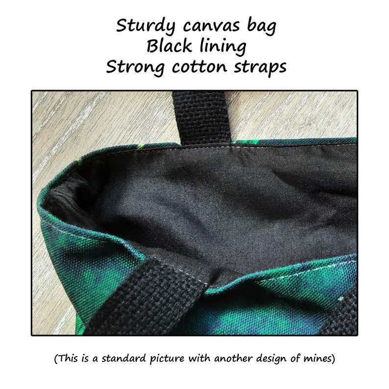 May include: A green and black canvas tote bag with black cotton straps and a black lining. The bag is made of sturdy canvas and has a simple design.