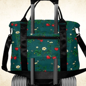 Strawberries on deep teal duffle bag with luggage sleeve, ladies floral travel bag with handles strap, vivid fruits patterned underseat bag