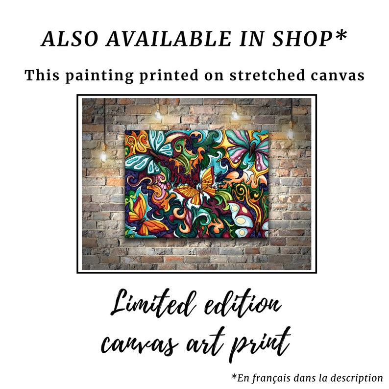 May include: A limited edition canvas art print featuring a colorful abstract design with butterflies and floral elements. The print is displayed on a brick wall with lights above it.