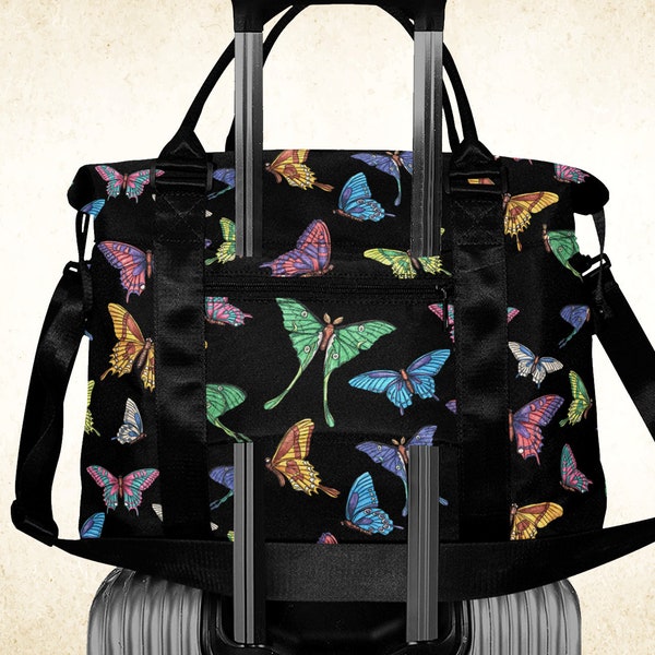 Butterflies on black nylon duffle bag with luggage sleeve, alt girly dark underseat cabin tote with strap, whimsical luna moth overnight bag