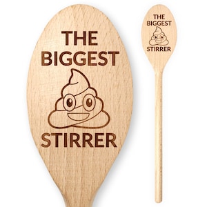 May include: Two wooden spoons with engraved text and a poop emoji. The larger spoon reads "THE BIGGEST STIRRER" with a smiling poop emoji wearing glasses. The smaller spoon reads "THE BIGGEST STIRRER" with a similar emoji.