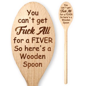 May include: Two wooden spoons with engraved text. The larger spoon reads "You can't get Fuck All for a FIVER So here's a Wooden Spoon." The smaller spoon has the same text. Both spoons are light brown.