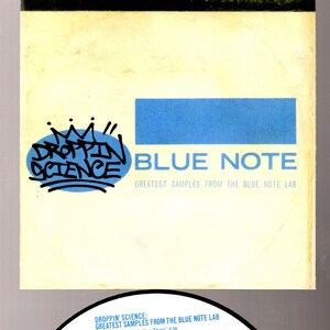 May include: A blue and white CD with the text "Droppin' Science: Greatest Samples from the Blue Note Lab" and a list of songs and artists. The CD is labeled "Blue Note" and has a warning about unauthorized copying.