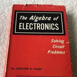 May include: A red hardcover book titled "The Algebra of Electronics: Solving Circuit Problems" by Chester H. Page. The book cover features white text and a black border around the title.