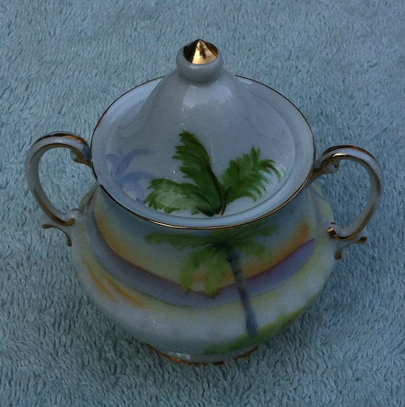 Small ceramic Japanese made vase and top