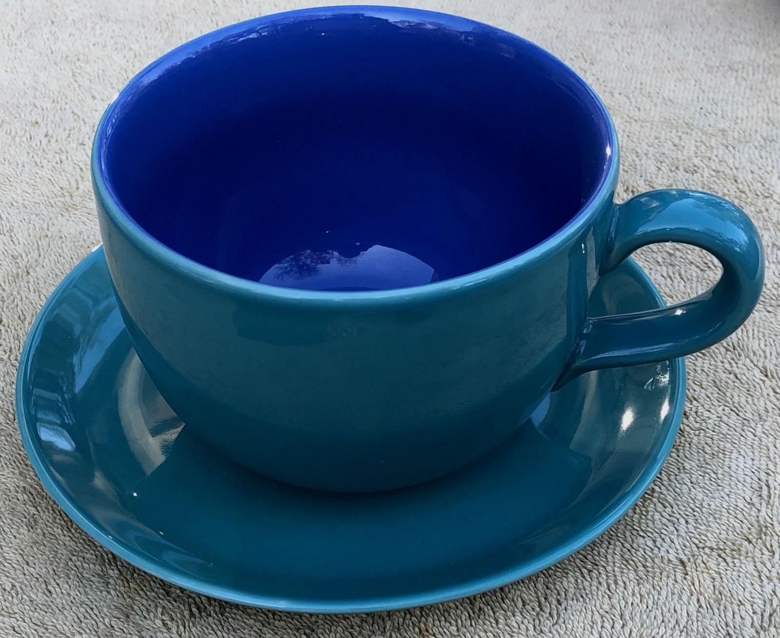 large coffee cup with saucer