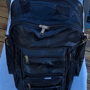 Duffel Bag/back pack on rollers, black leather