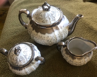 Sterling China silver - teapot, sugar bowl and creamer