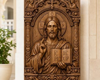 May include: A rectangular wooden wall plaque featuring a detailed relief carving of Jesus Christ holding an open book with the text IC XC IHC XIP. The figure is framed by ornate columns, a cross at the top, and two small winged angels in the corners.