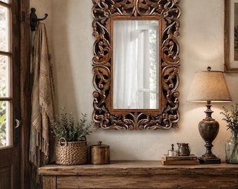 May include: A rectangular wall mirror featuring a dark brown wooden frame with intricate, deep-relief carved scrollwork and floral motifs. The reflective glass surface is centered within the ornate, symmetrical border, showcasing a smooth finish.
