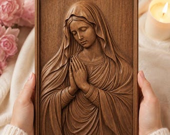 May include: A rectangular wooden wall plaque featuring a detailed relief carving of a woman with a head covering and hands clasped in prayer. The carving displays natural wood grain textures and deep brown tones, framed within a simple wooden border.