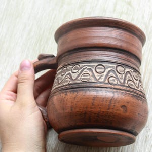 Clay and Milk taza de barro
ceramic stone ware Scandinavian pottery
Organic Handthrown clayware tableware
oversized rustic mug plain clay mug
Eco friendly coffee pottery Unglazed mug
stoneware dinnerware mug Big coffee mug
