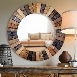 May include: A large round wall mirror featuring a decorative frame constructed from numerous small, rectangular wooden slats arranged in a radial pattern. The slats display a variety of natural wood tones, ranging from light tan to dark brown.