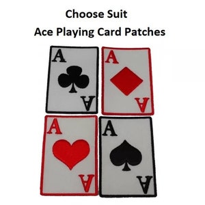 May include: Five iron-on patches featuring the ace of spades, hearts, diamonds, and clubs. The patches are white with red and black accents. One patch is reflective and has an arrow pointing to it.