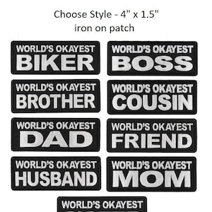 May include: Nine iron-on patches with black backgrounds and white text. Each patch reads "World's Okayest" followed by a different title, such as "Biker", "Boss", "Brother", "Cousin", "Dad", "Friend", "Husband", "Mom", and "Sister".