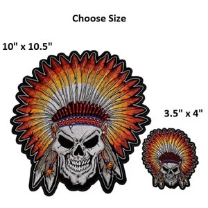 May include: Two embroidered iron-on patches of a skull wearing a Native American headdress. The larger patch is 10 inches by 10.5 inches and the smaller patch is 3.5 inches by 4 inches.