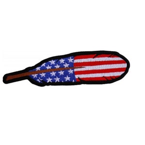 May include: Embroidered patch in the shape of a feather, featuring the American flag design. The feather has a brown stem, a blue section with white stars, and a red and white striped section. The patch is outlined in black.