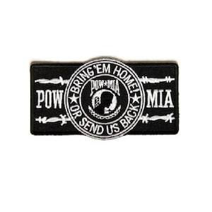 May include: Black and white embroidered patch with the text "Bring 'em Home! POW or Send Us Back! MIA" and a silhouette of a soldier's head inside a circle.