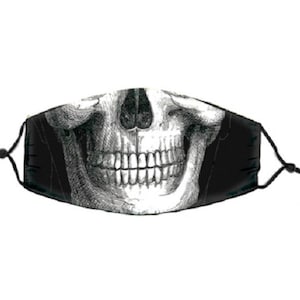 May include: Black face mask with a white skull and teeth graphic print.
