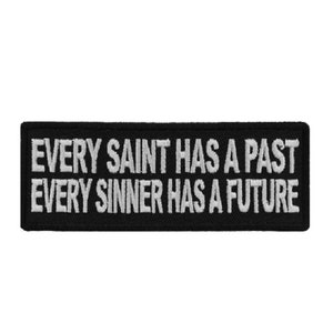 May include: Black embroidered patch with white text that reads "Every Saint Has A Past Every Sinner Has A Future."