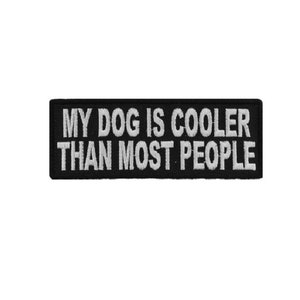 May include: Black embroidered patch with white text that reads "My dog is cooler than most people."