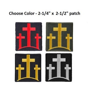 May include: Four square patches, each featuring a cross design. The patches are in various color combinations: red crosses on black, gold crosses on olive green, gold crosses on black, and silver crosses on black. Text reads: Choose Color - 2-1/4" x 2-1/2" patch.